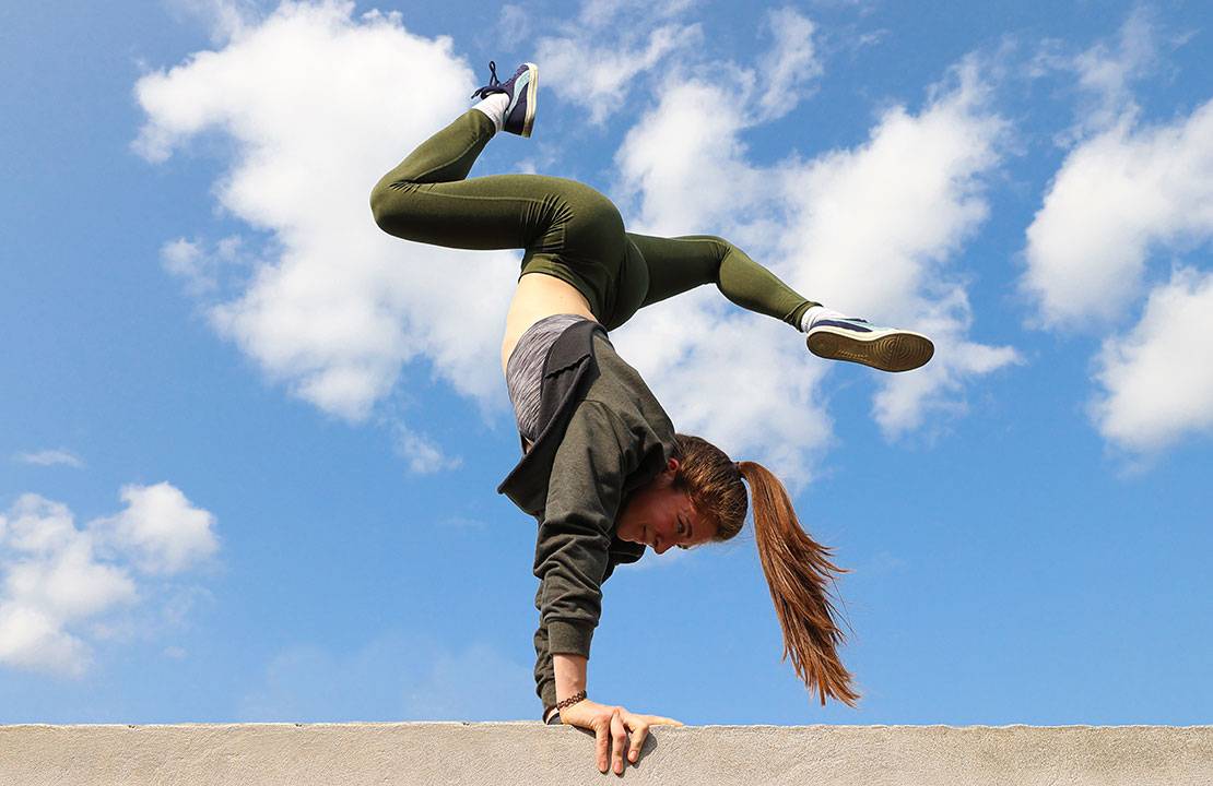 woman doing a handstand