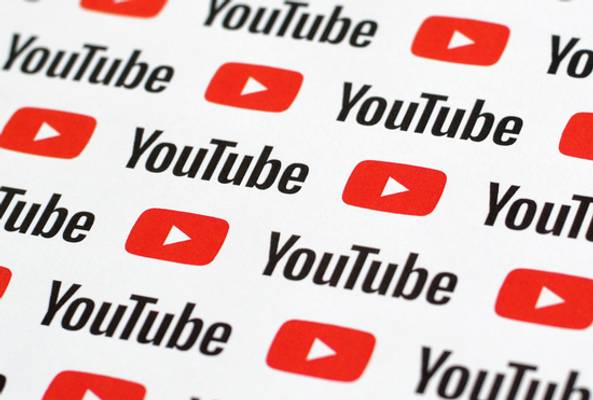Pattern of red YouTube play button logos and black YouTube text on white background