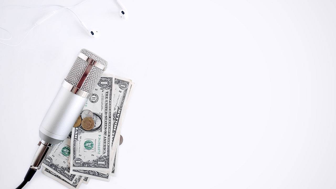 Microphone next to a few dollar bills