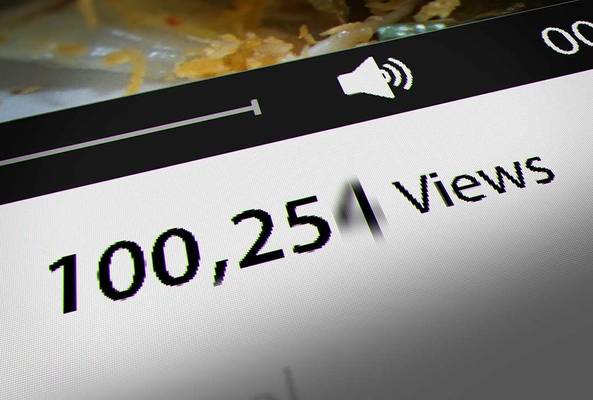 Close-up of video player screen showing 100,251 views and audio icon on playback bar.