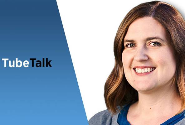 Smiling woman on white background with blue panel and TubeTalk logo for video podcast