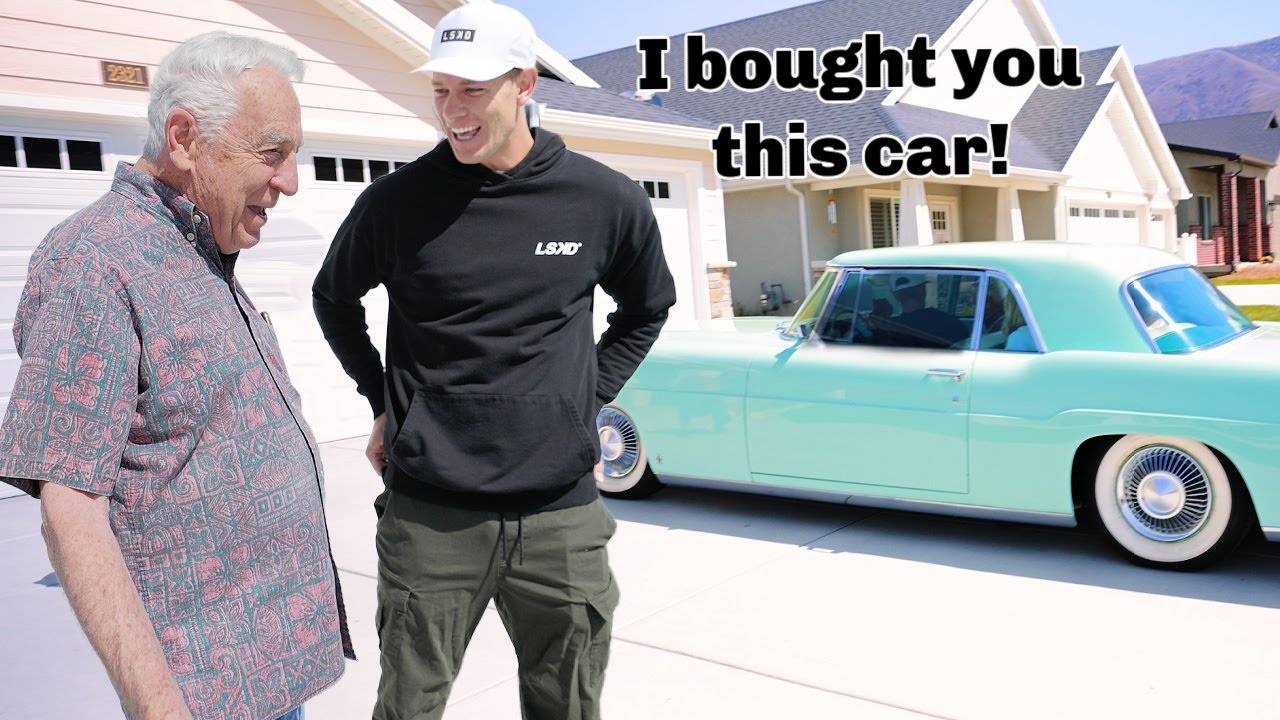 A man showing his grandpa the car he bought for him