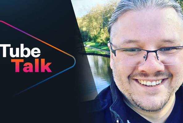 Tube Talk logo with a smiling man outdoors near a river, promoting video podcast content.