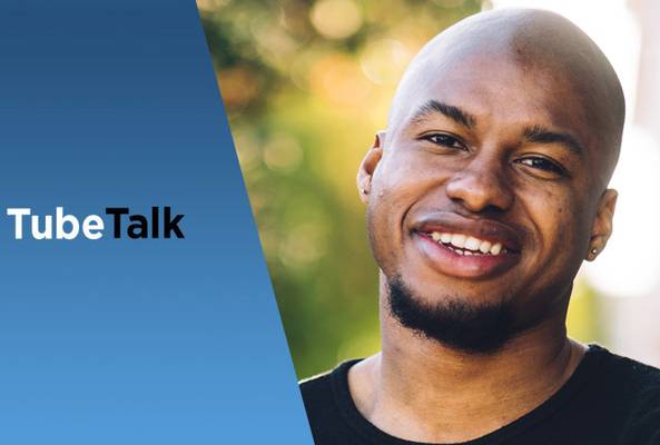 Smiling man with black shirt next to TubeTalk logo on a blue gradient background