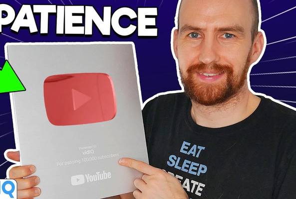 Man holding YouTube Silver Play Button award for 100,000 subscribers with patience text.