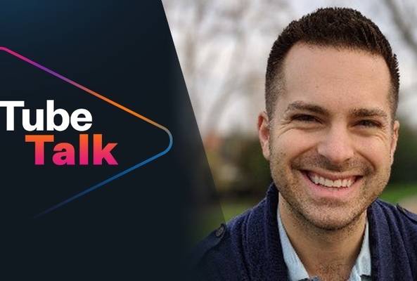 Smiling man next to Tube Talk logo, representing a video or podcast discussion platform.