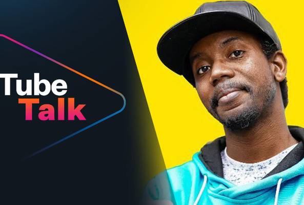 Logo of Tube Talk with man in blue hoodie and black cap on yellow background