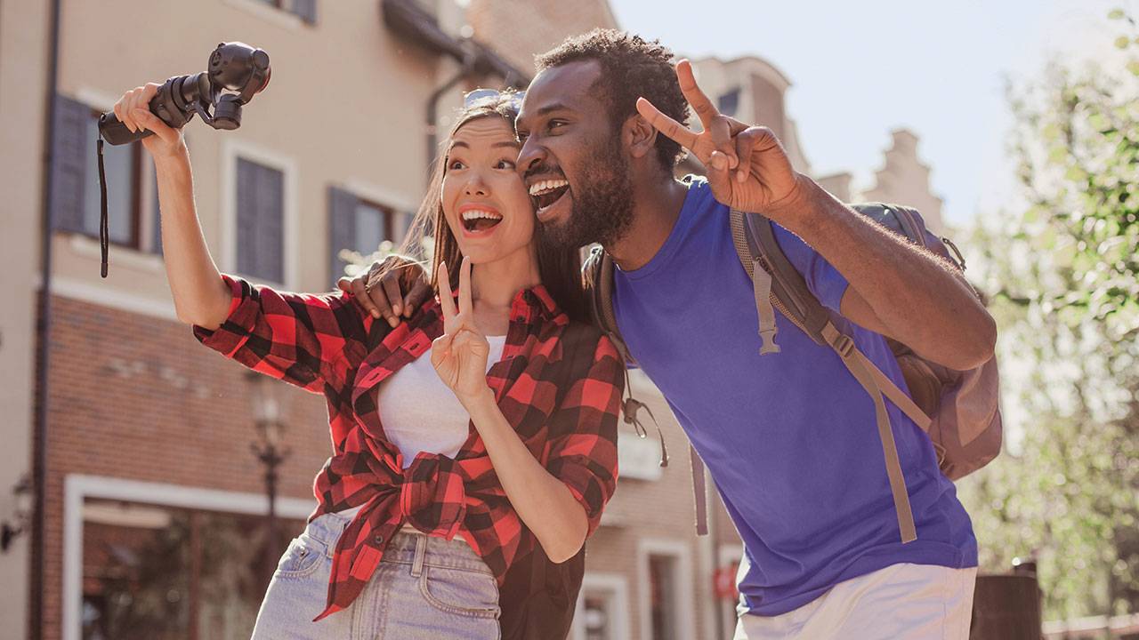A man and a woman making a YouTube video