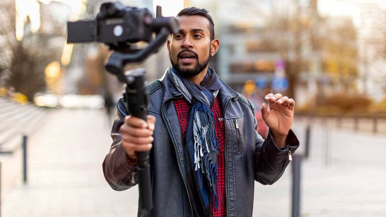 A man vlogging on the street
