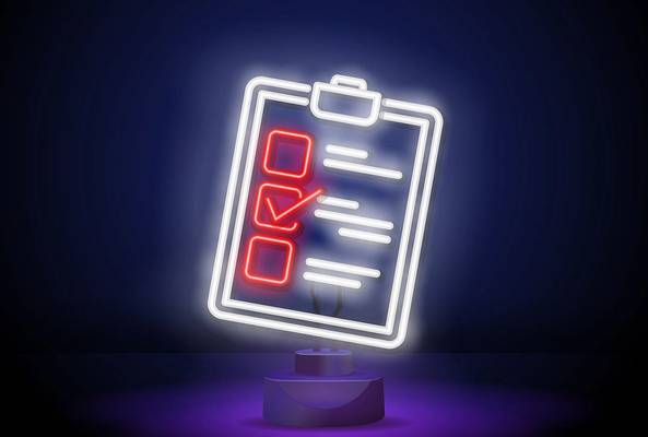 Neon light sign of a checklist clipboard with one red checkmark on dark background