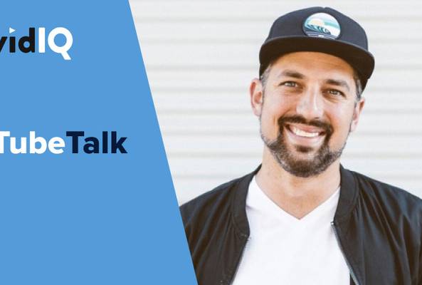 Smiling man wearing a cap and jacket next to vidIQ Tube Talk branding on blue background