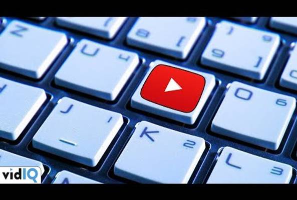 Keyboard with a red YouTube play button key representing video content creation.