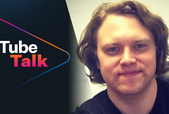 Smiling man with Tube Talk logo, video podcast branding on black background