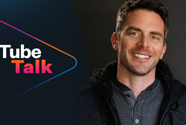 Smiling man next to Tube Talk logo on dark background for video podcast branding