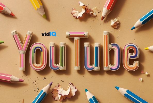 YouTube text made of colored pencil shavings surrounded by sharpened colored pencils on beige background